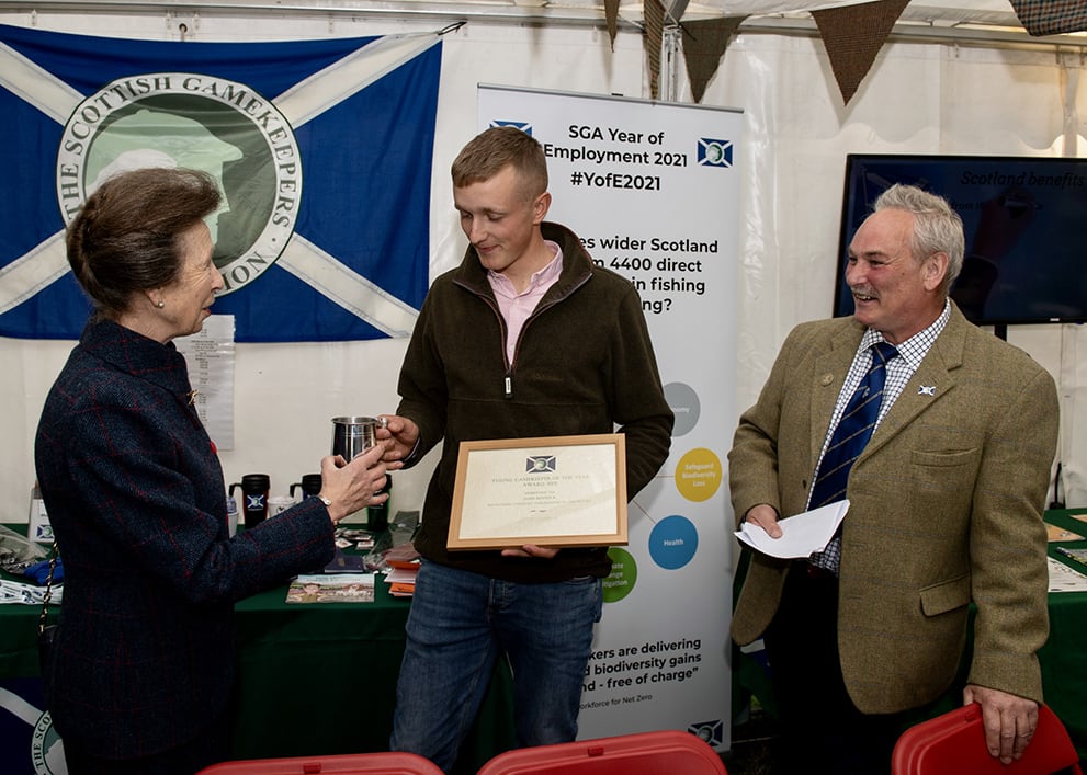 Jamie Renwick receives the Young Gamekeeper of the Year award from the Princess Royal.