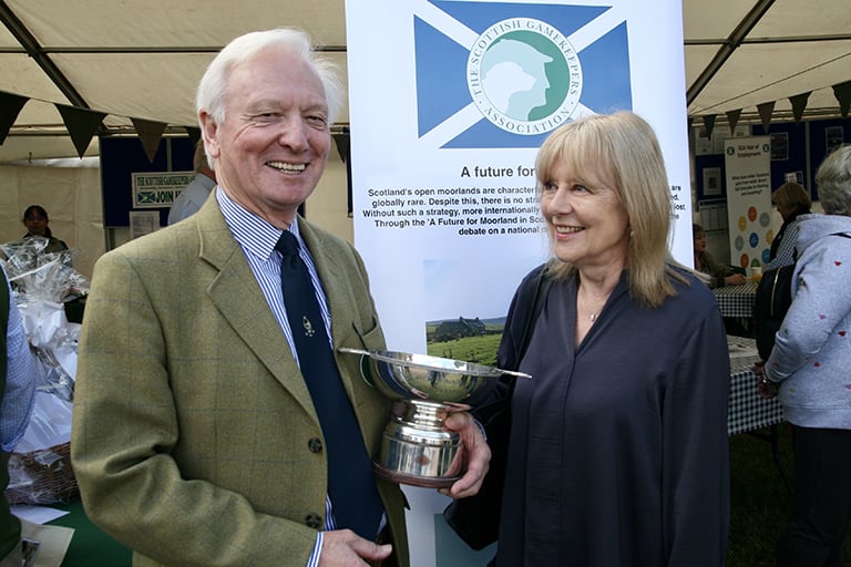 Author Ian Coghill collects the Ronnie Rose award from Scottish Gamekeepers Association Chairman Alex Hogg, MBE.