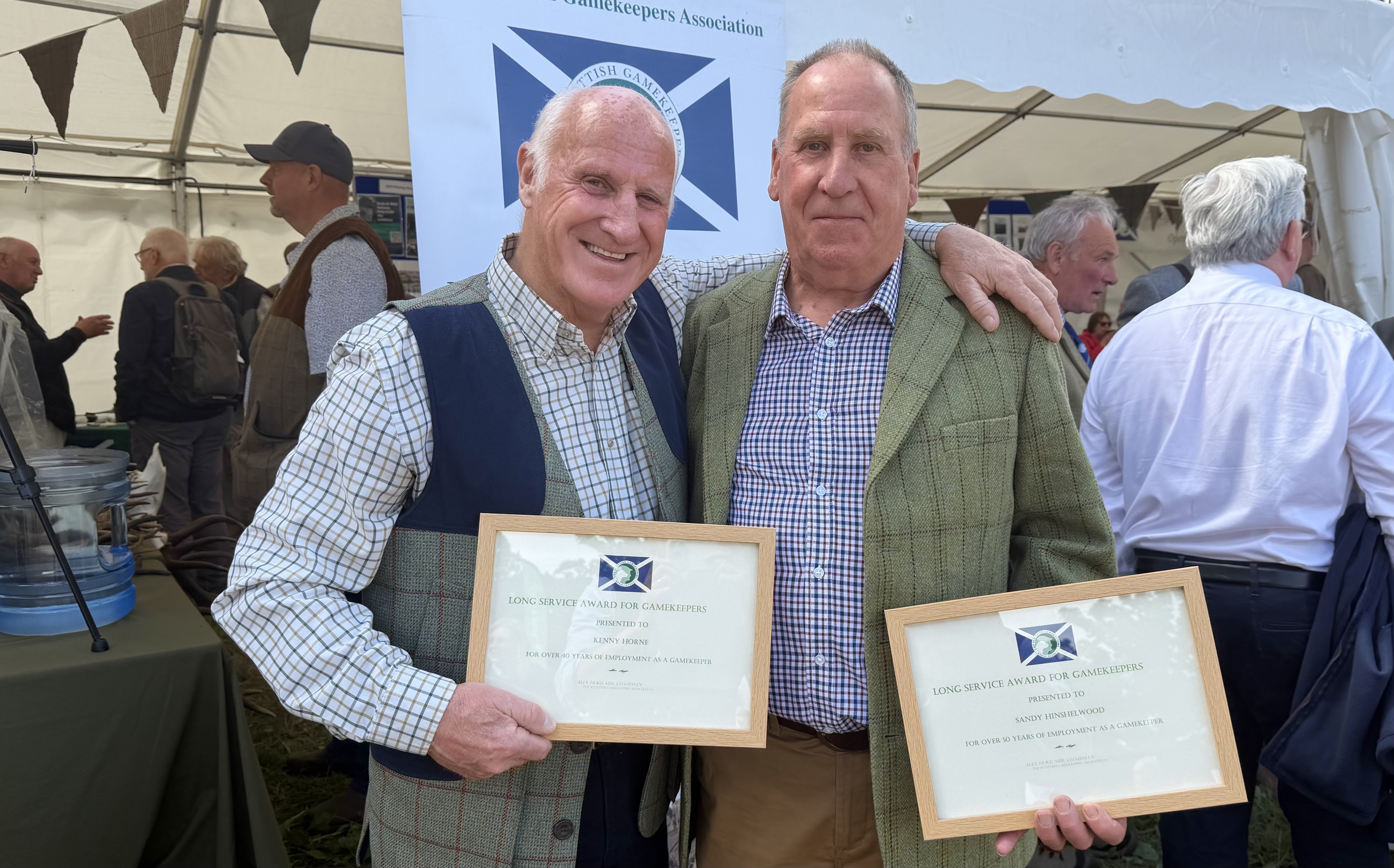 Kenny Horne (left) and Sandy Hinshelwood with their Long Service medals from The Scottish Gamekeepers Association